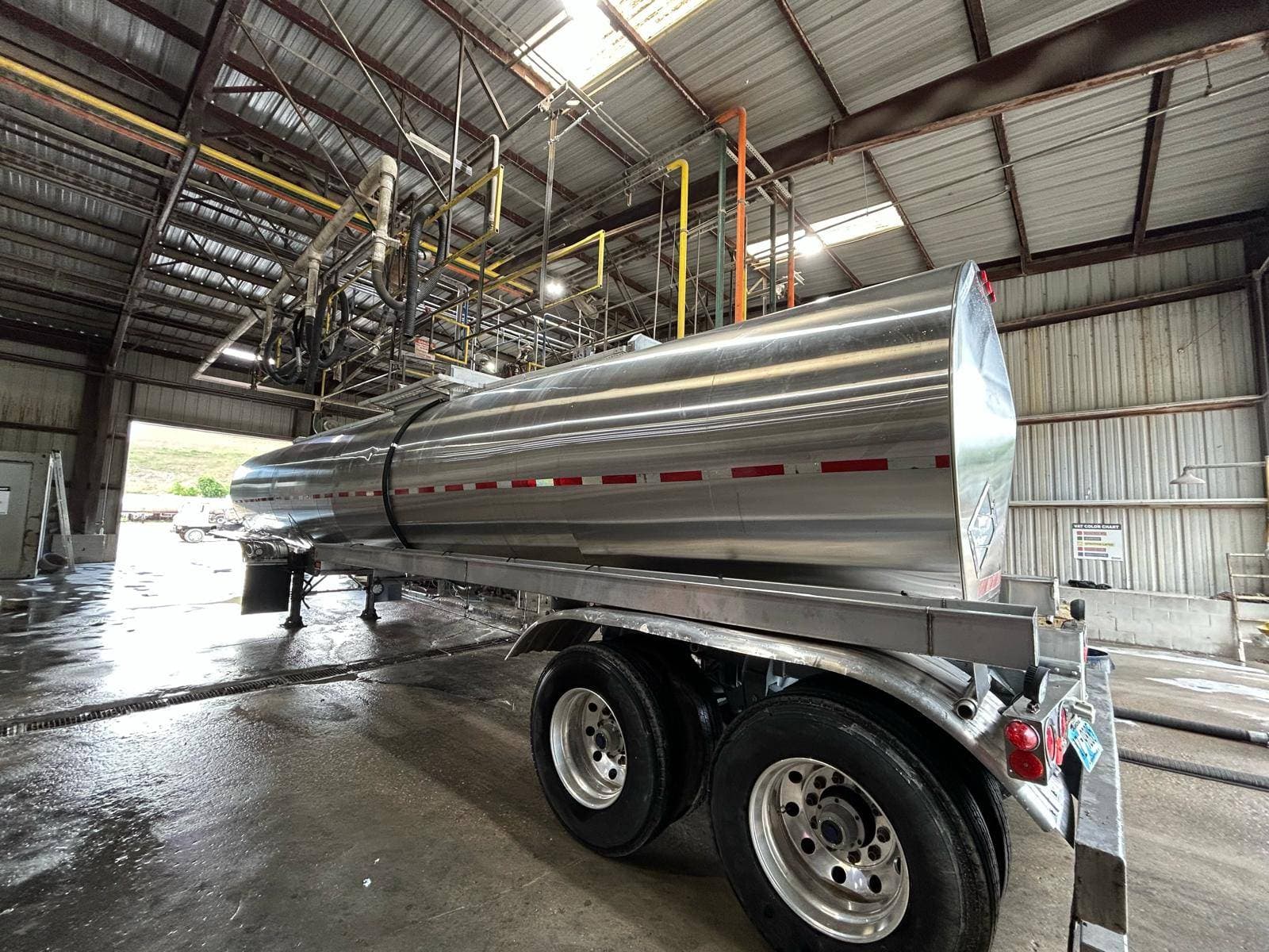 TRS Multiservices technician working on a tanker trailer